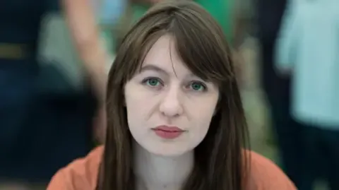 Sally Rooney claims she is unable to travel to the UK because of potential arrest